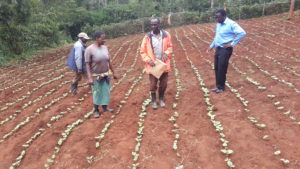 Dr. Boaz Waswa visiting farmer 